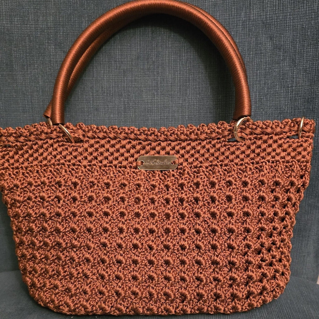 Copper-Brown crochet handbag with LizH Studios brand label on a gray background